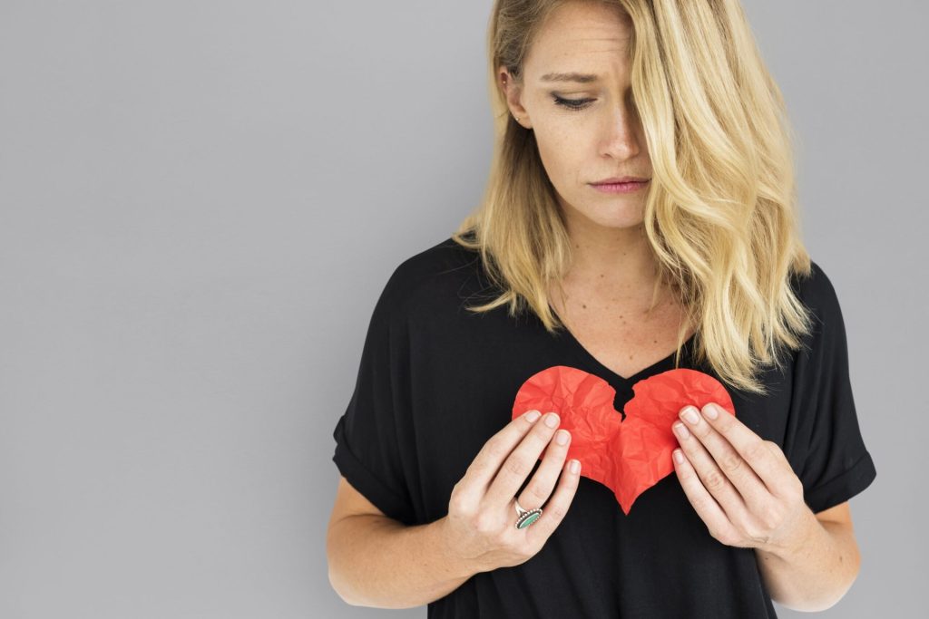 Woman with a broken or injured heart