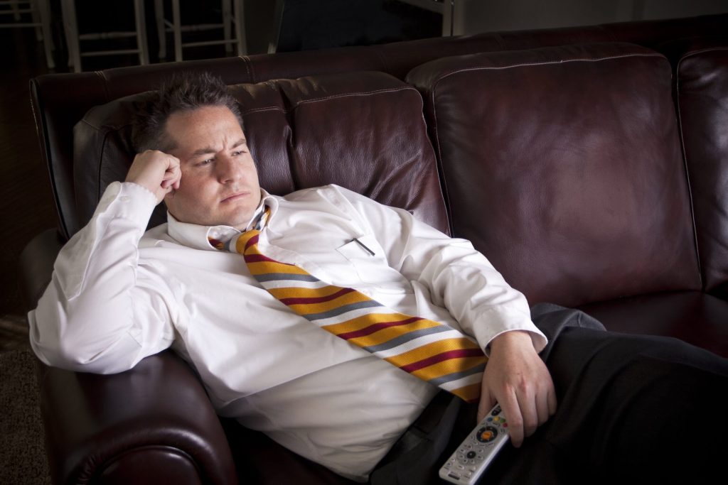 man watching TV at home.