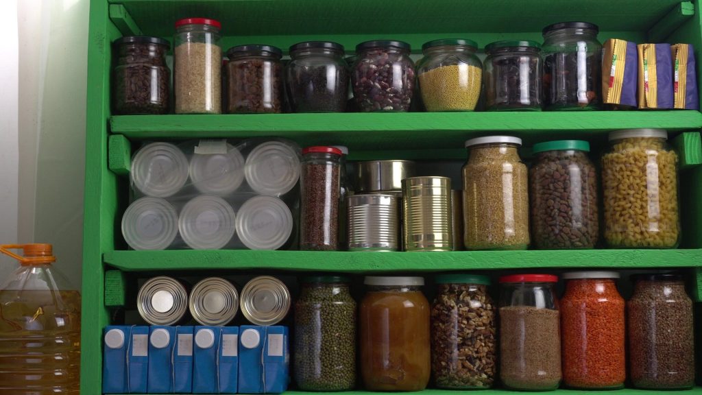 Home pantry shelves with long-term storage and canned products