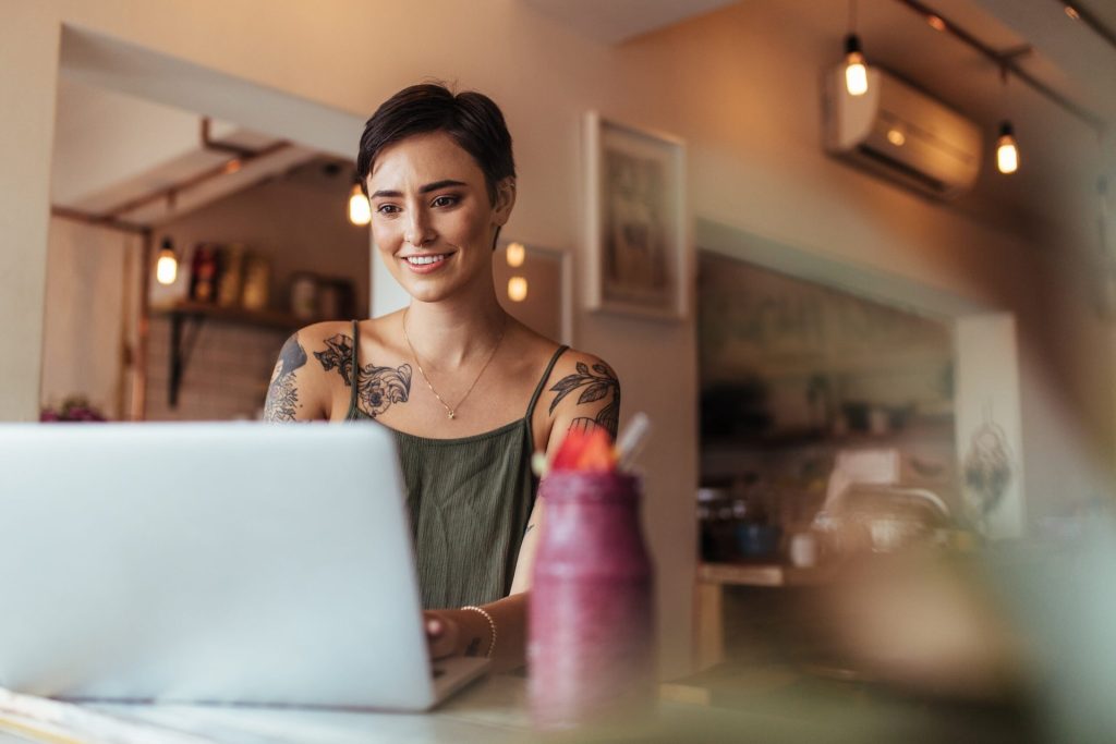 Woman using a laptop computer at home