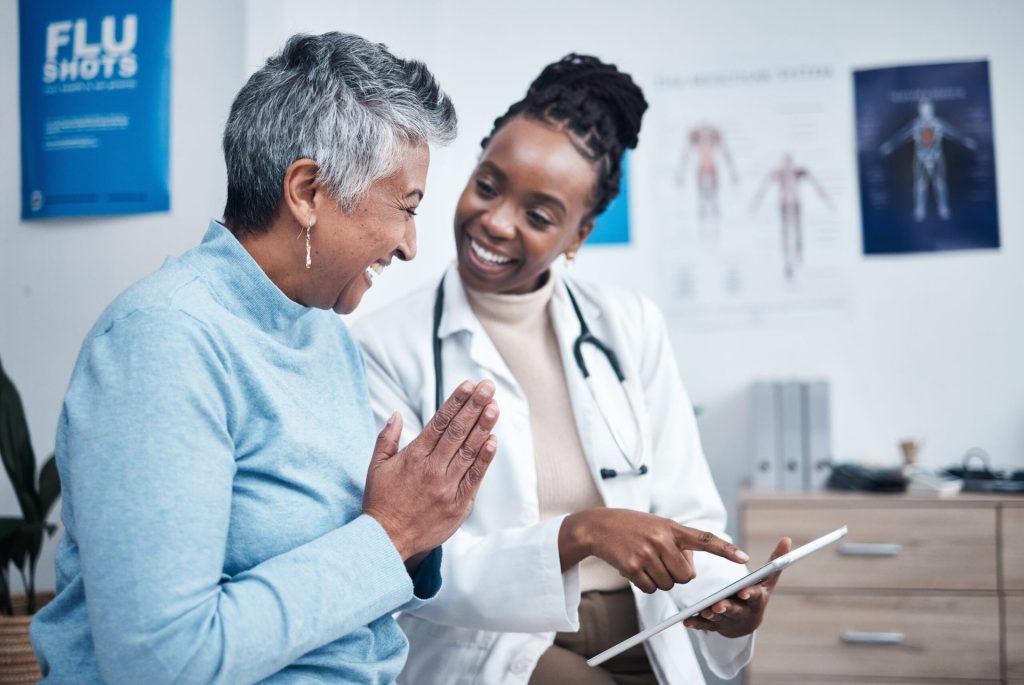 older woman speaking with doctor