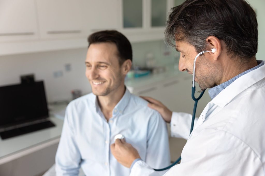 Doctor listening to a patient's heart beat