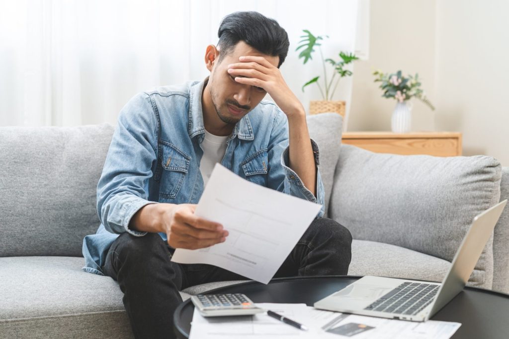 stressed out man considering financial future