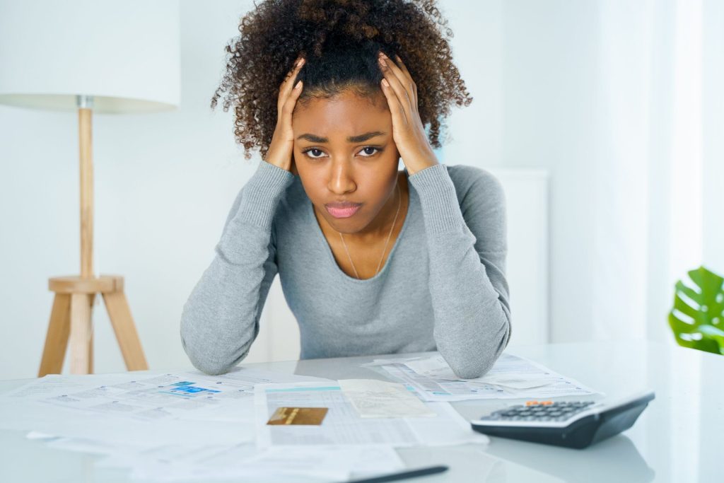 Unhappy woman with a credit card